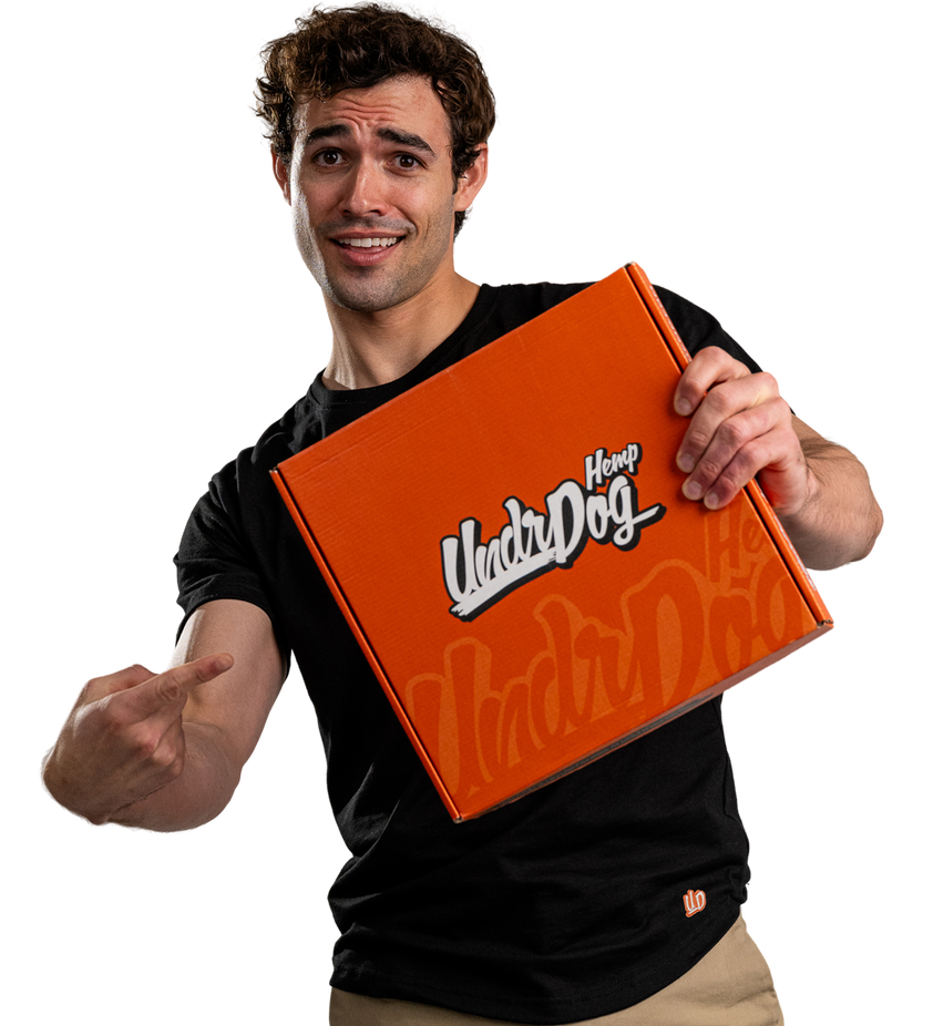 Person indicating a undrdog hemp box