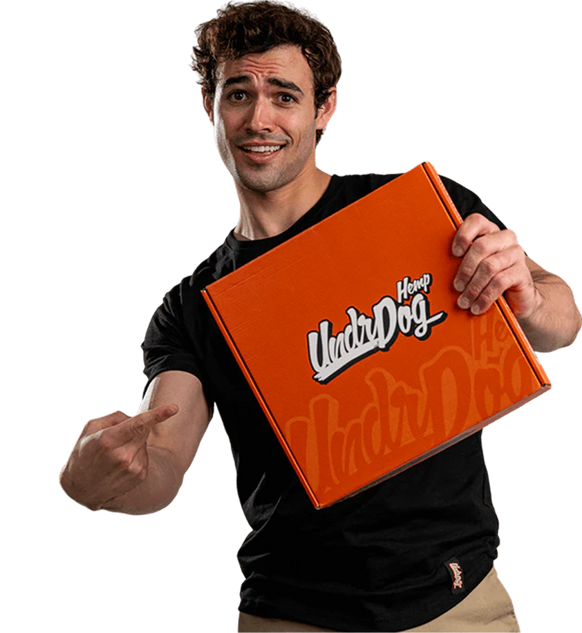 Person indicating a undrdog hemp box