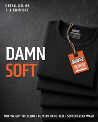Folded black UndrDog Midnight black hemp T-shirts highlighting soft mid-weight tri-blend fabric that softens with washing.